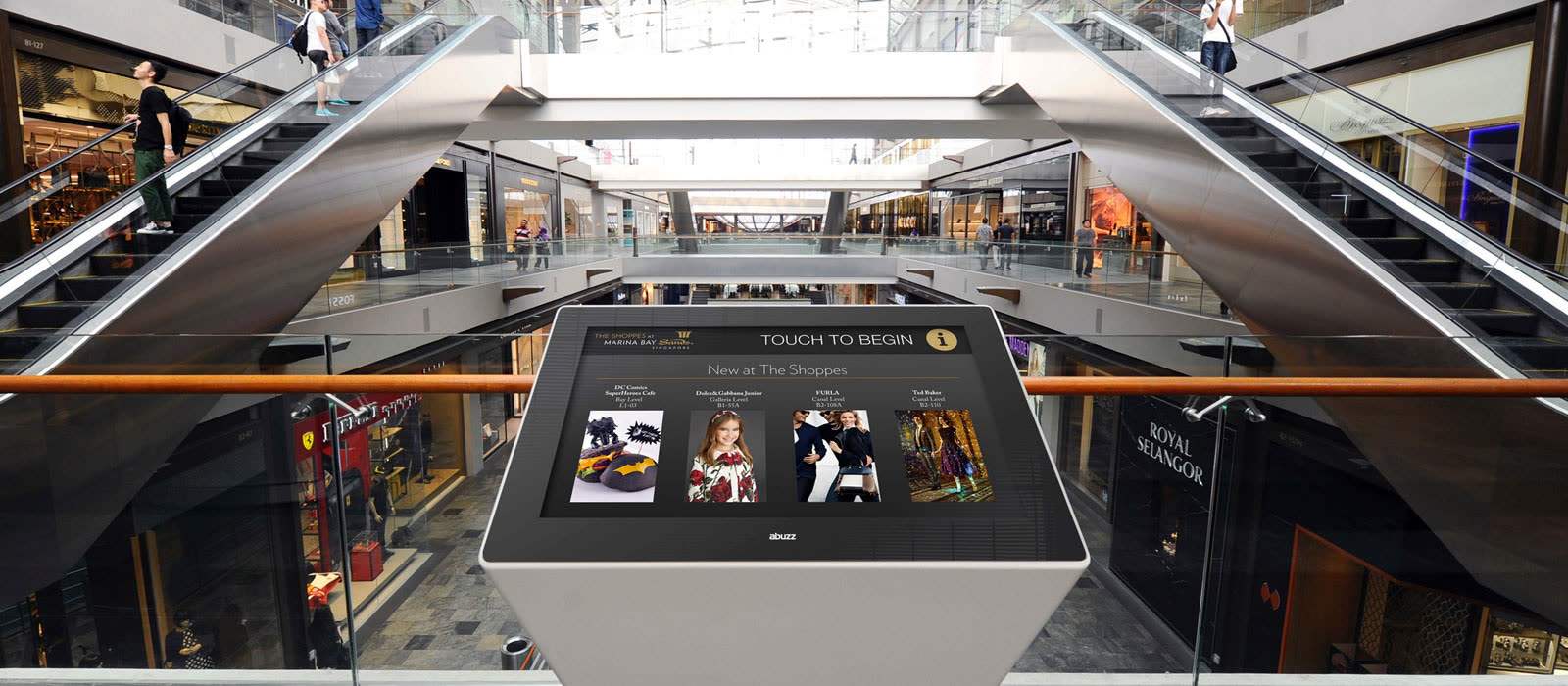 Interactive Abuzz digital directory kiosk in a Singapore shopping mall atrium