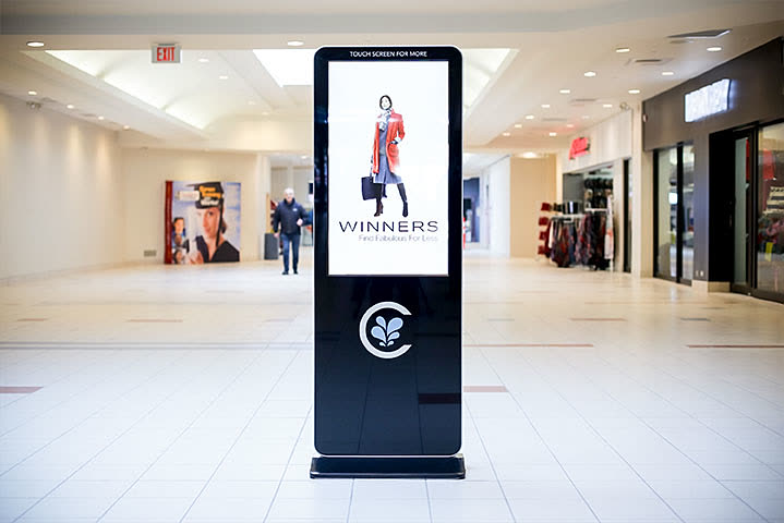 Abuzz advertising kiosk in a Canadian shopping centre corridor