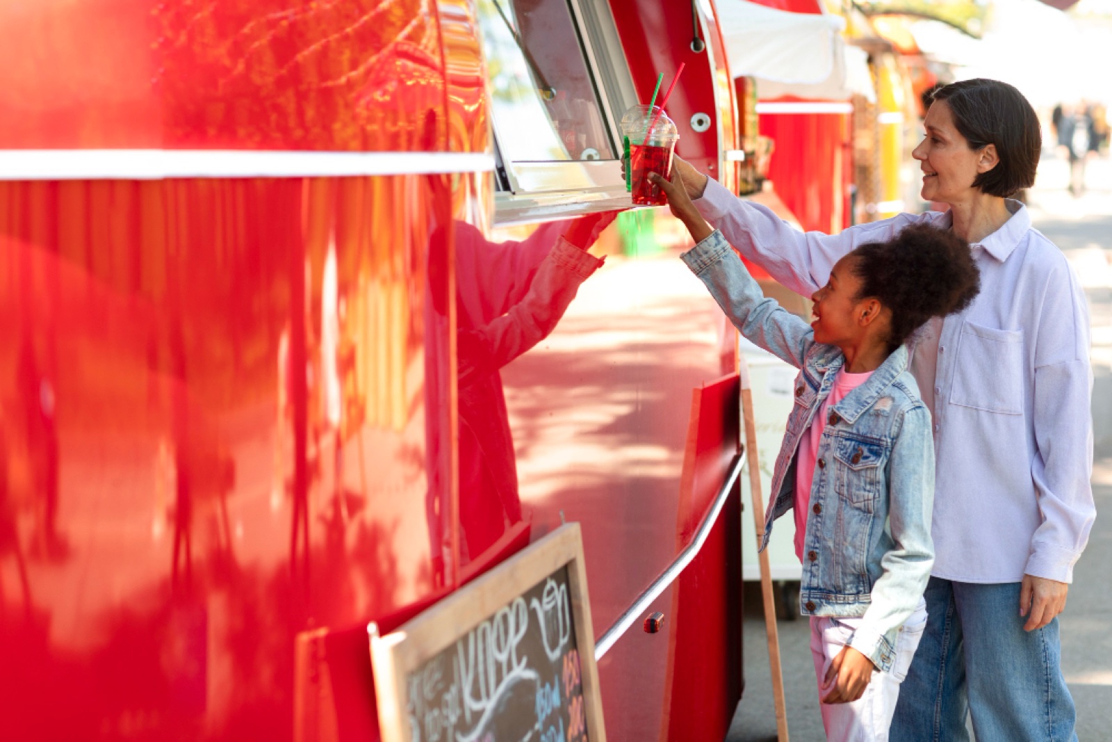 A family ordering at a Bistro catering trailer