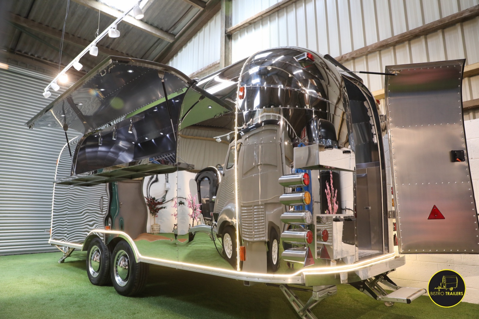 Side view of a Bistro Trailers stainless-steel catering trailer