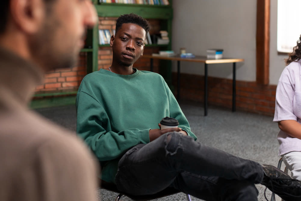 A young client taking part in a supportive group therapy session