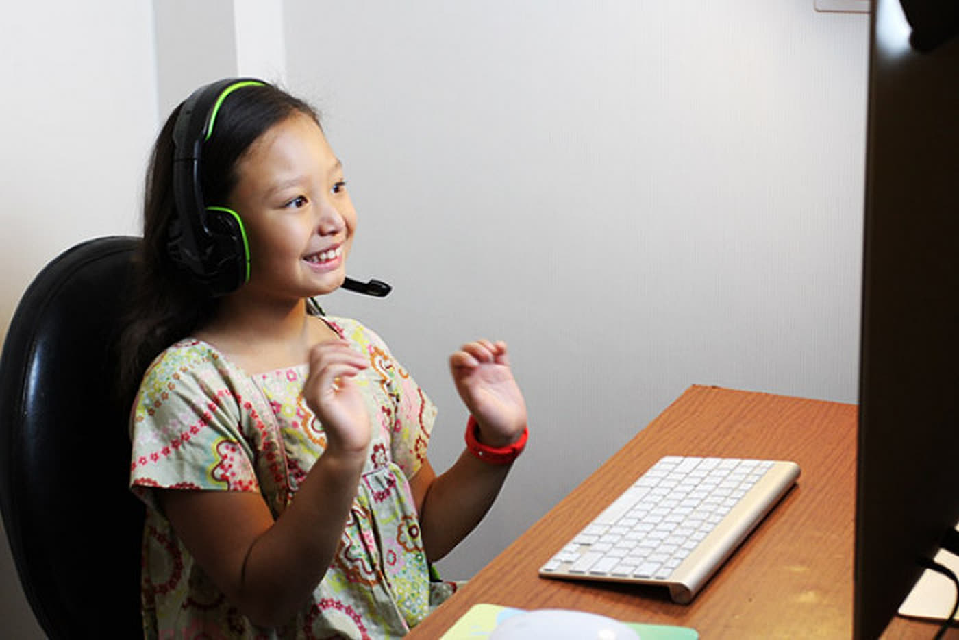 Young student wearing a headset during an English Gang online English lesson