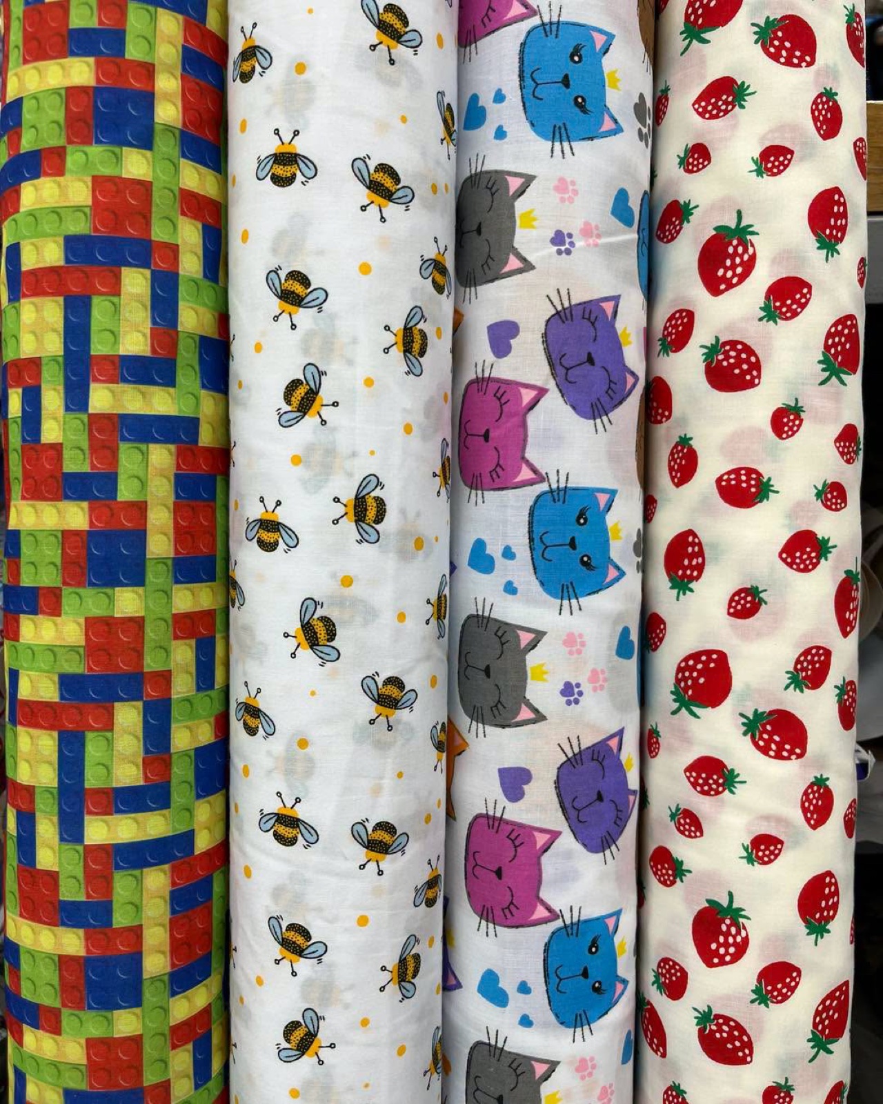 Rolls of patterned fabric on display at Franklins