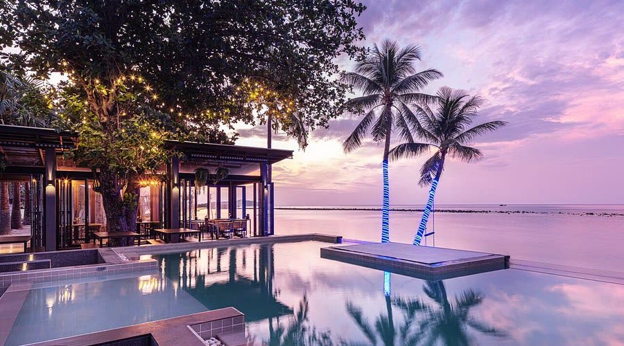 Sunset over the beachfront pool at Lub d Koh Samui