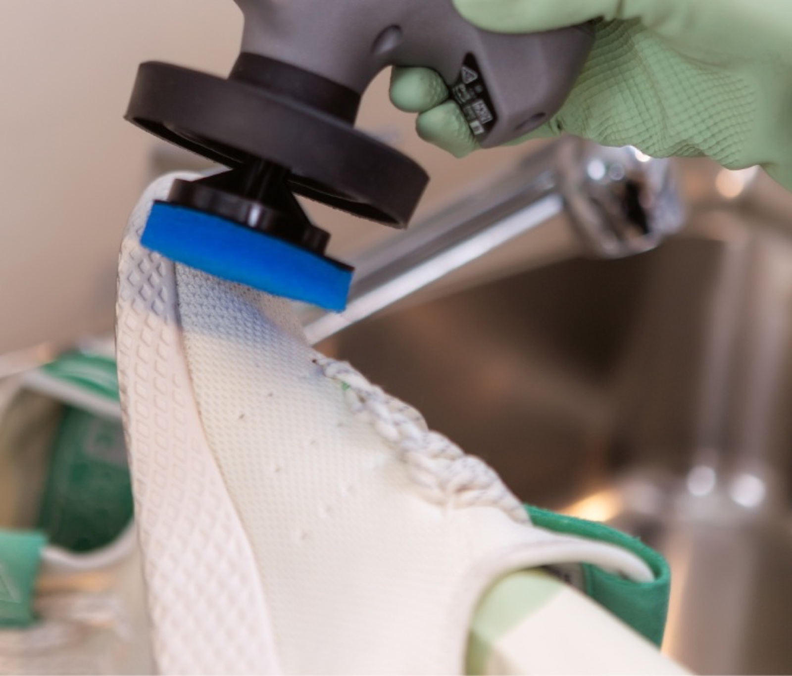 Close-up of a sneaker being cleaned by mylaundry