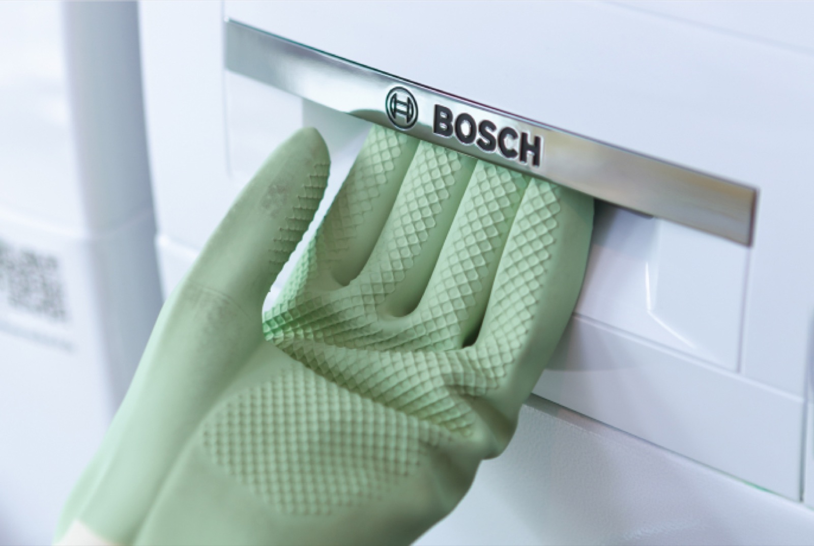 Loading laundry into a Bosch washing machine at mylaundry