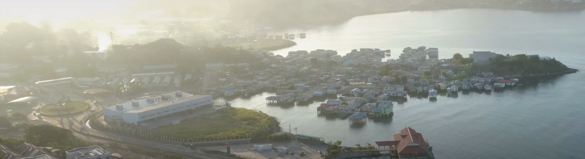 Aerial view of Port Moresby harbour at sunrise, host city of the PNG Petroleum and Energy Conference