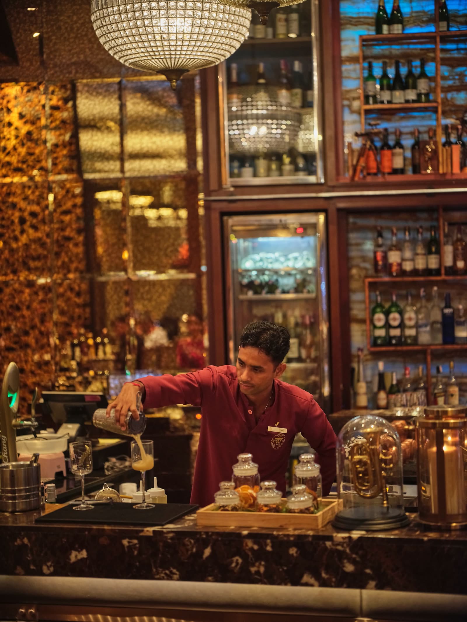 Bartender preparing cocktails at the Punjab Grill bar