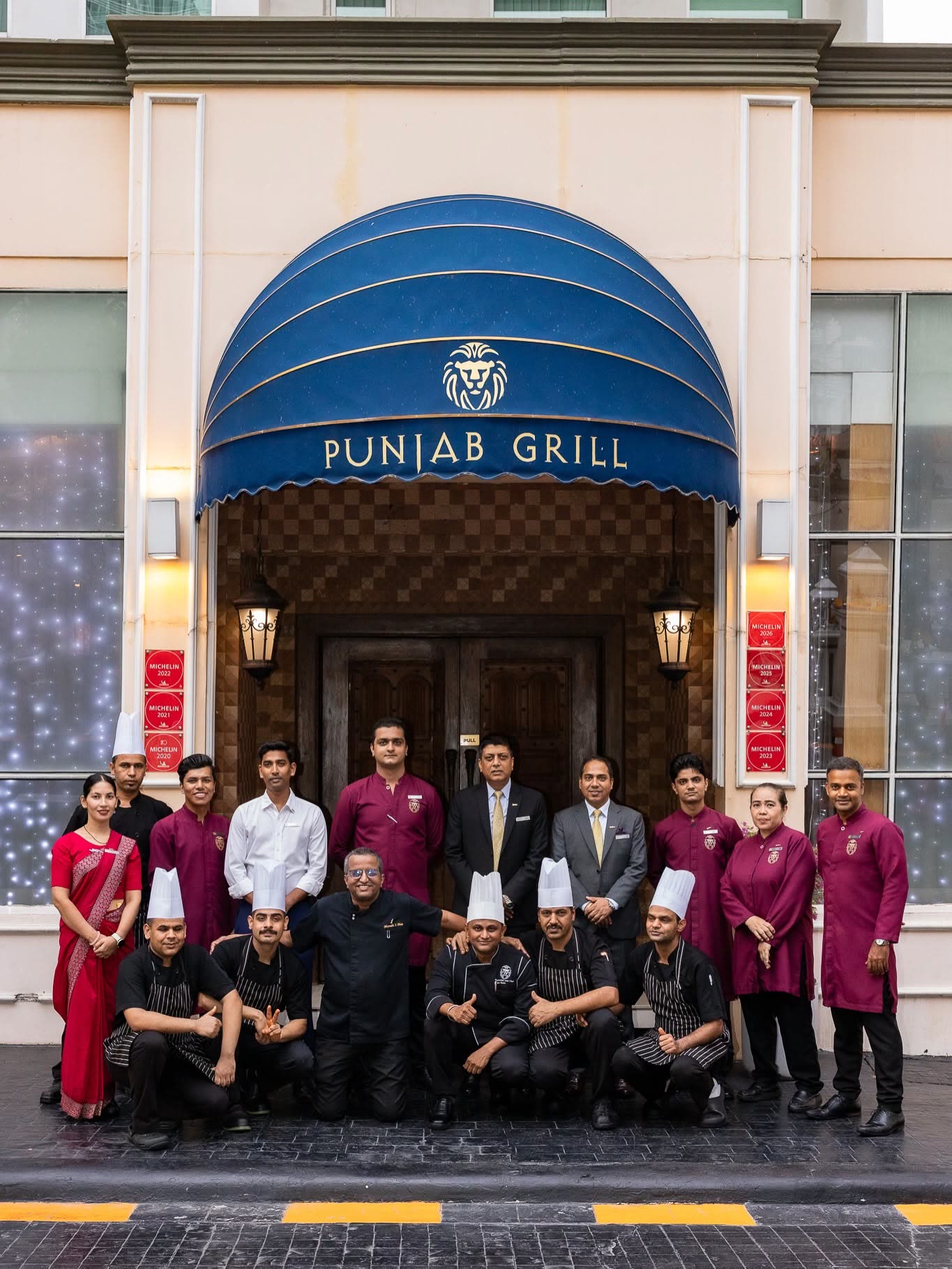 The Punjab Grill team gathered outside the Bangkok restaurant