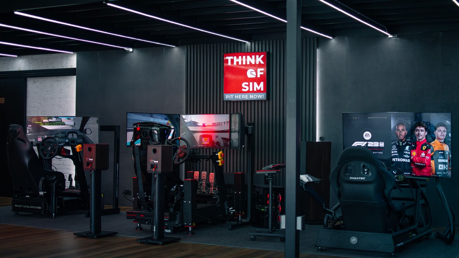 Think of Sim flagship showroom with branded sign and racing simulator rigs