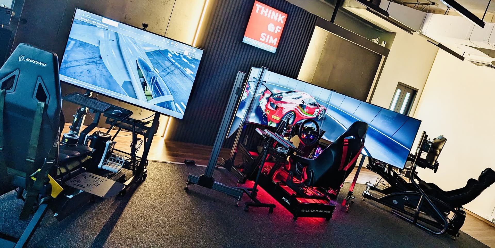 Triple-screen racing simulator rigs at Think of Sim