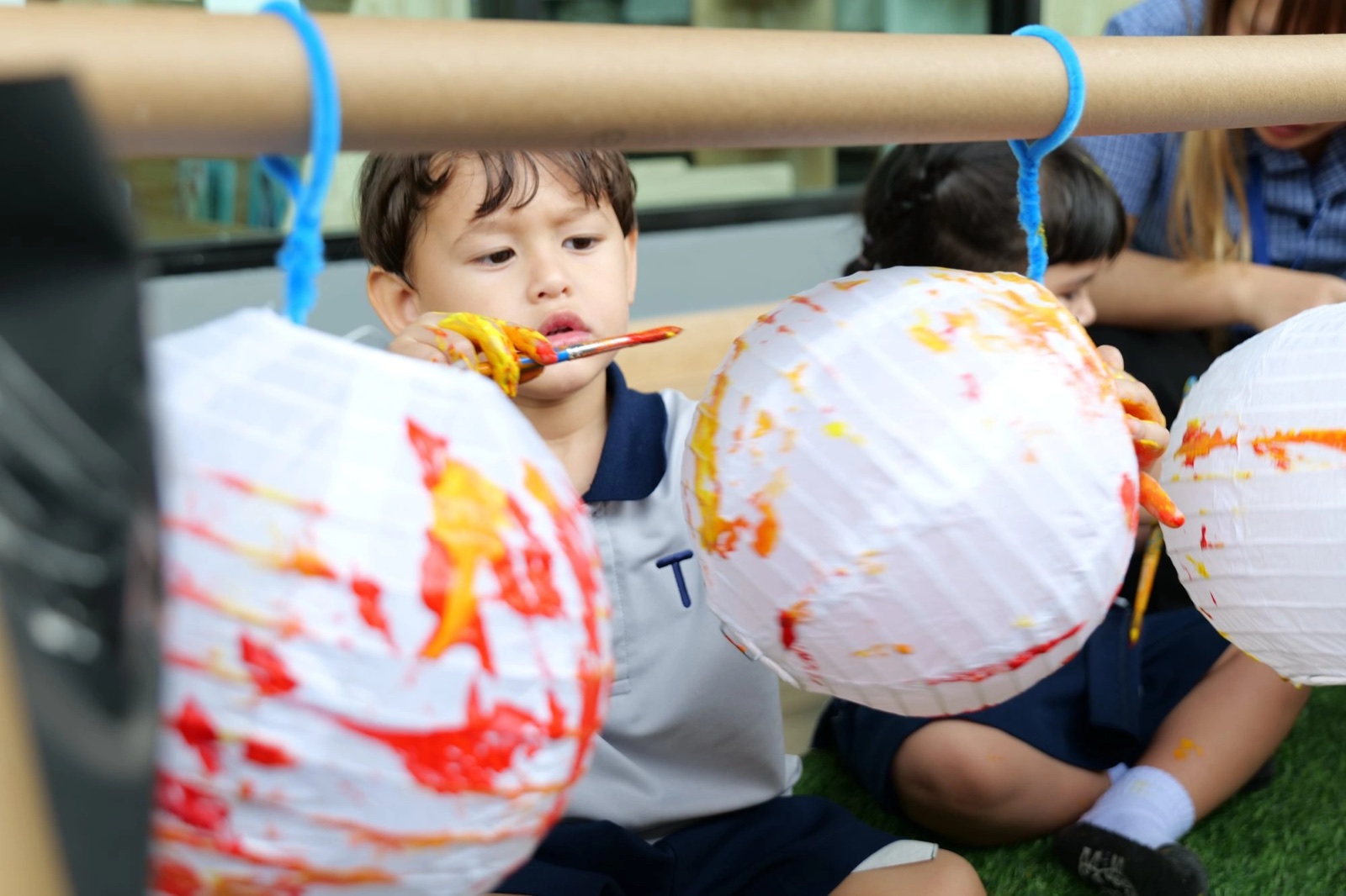 TSI International School students making paper lanterns