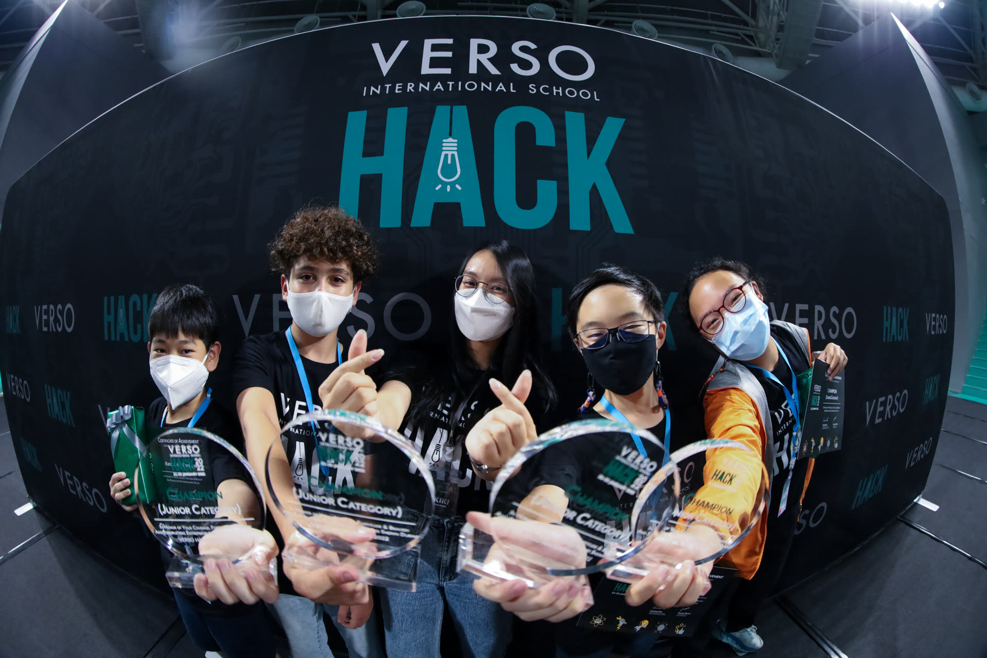 VERSO students celebrating with trophies at the VERSO HACK event